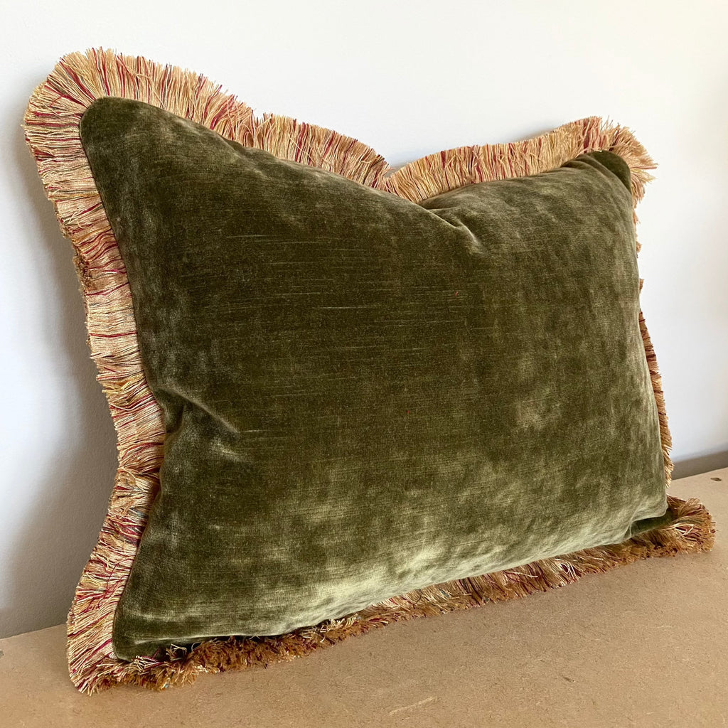 Green velvet cushion with gold trim