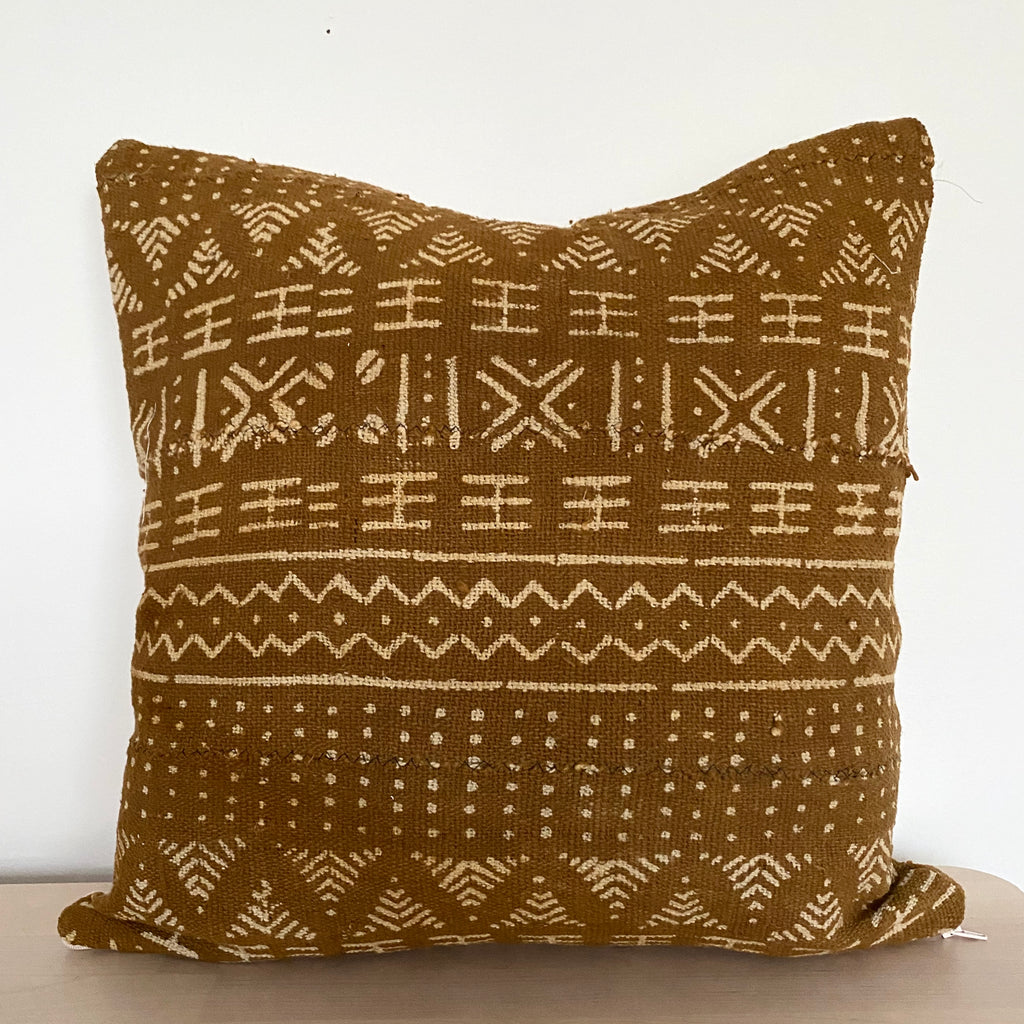 mustard mudcloth cushion